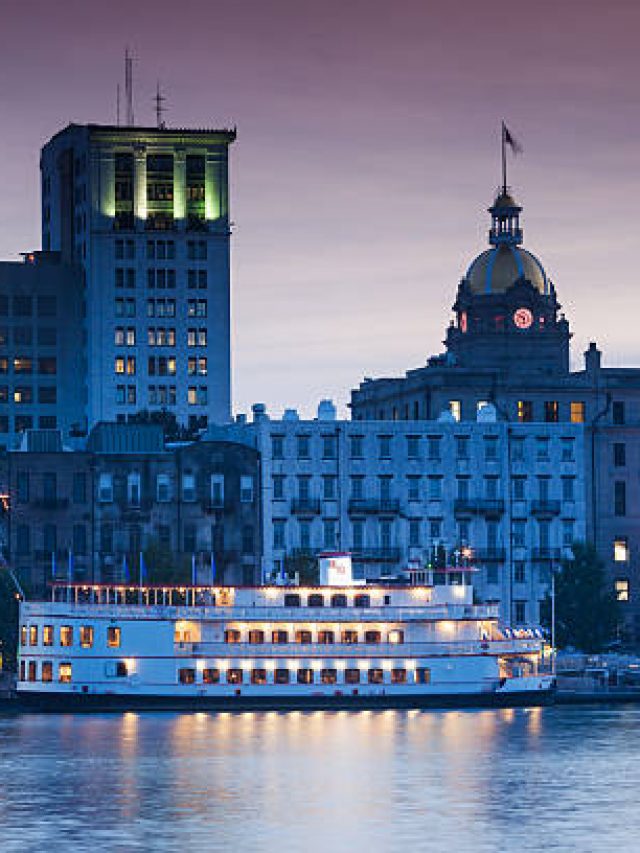 USA, Georgia, Savannah, skyline along the Savannah River, dusk.